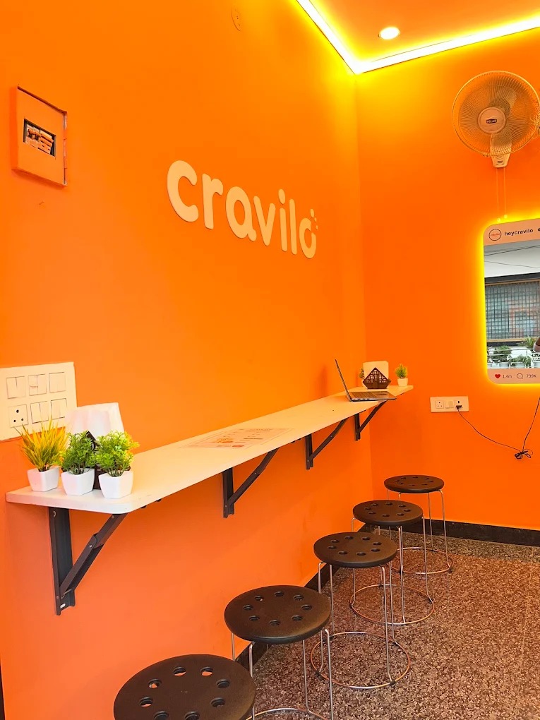 Friends laughing in the Cravilo cafe